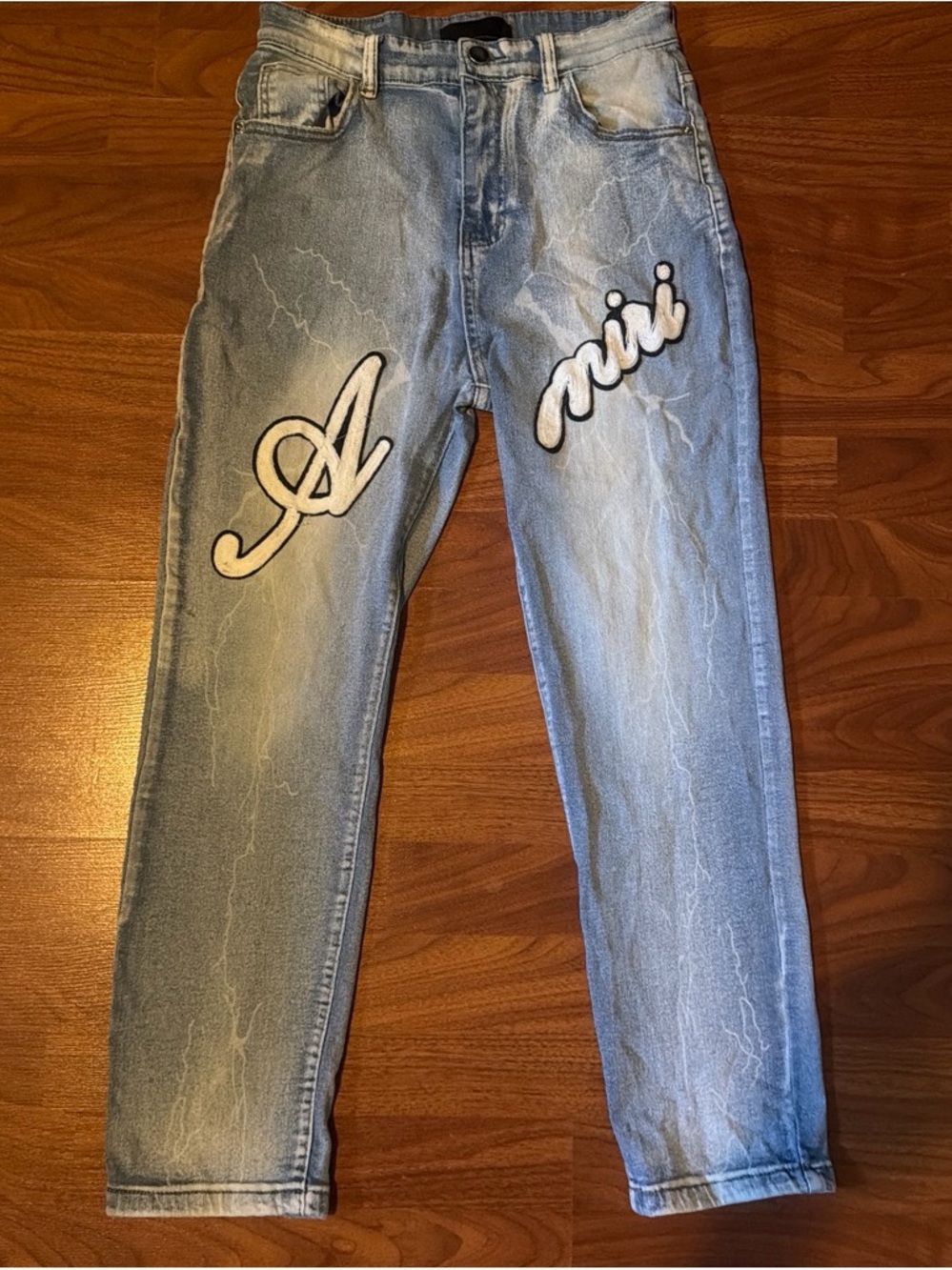 Light Wash Blue Men’s Amiri Jeans with White Script Patch